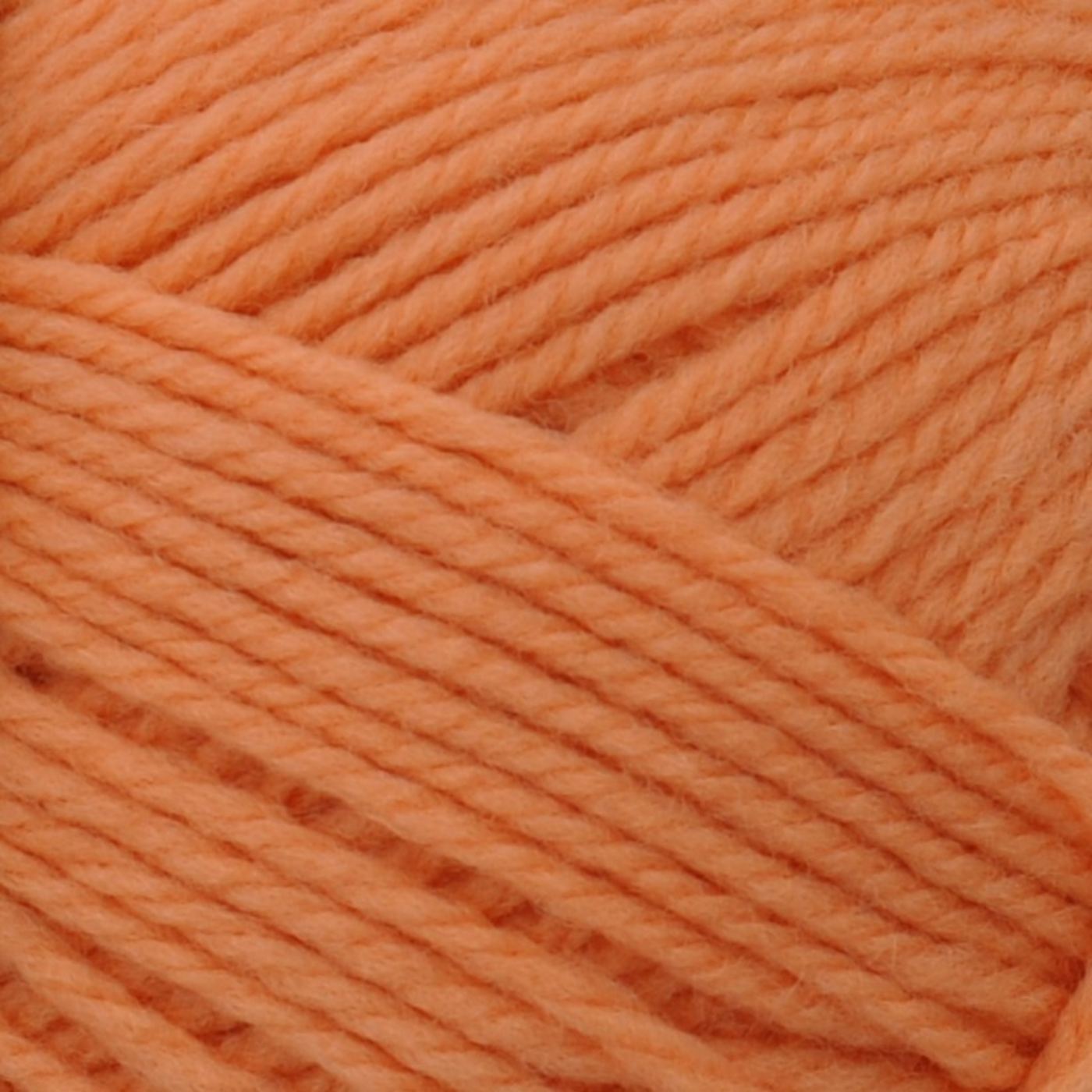 Brown Sheep Nature Spun Worsted wool yarn skein, Luscious Peach soft coral hue — 245 yds at Revolution Fibers