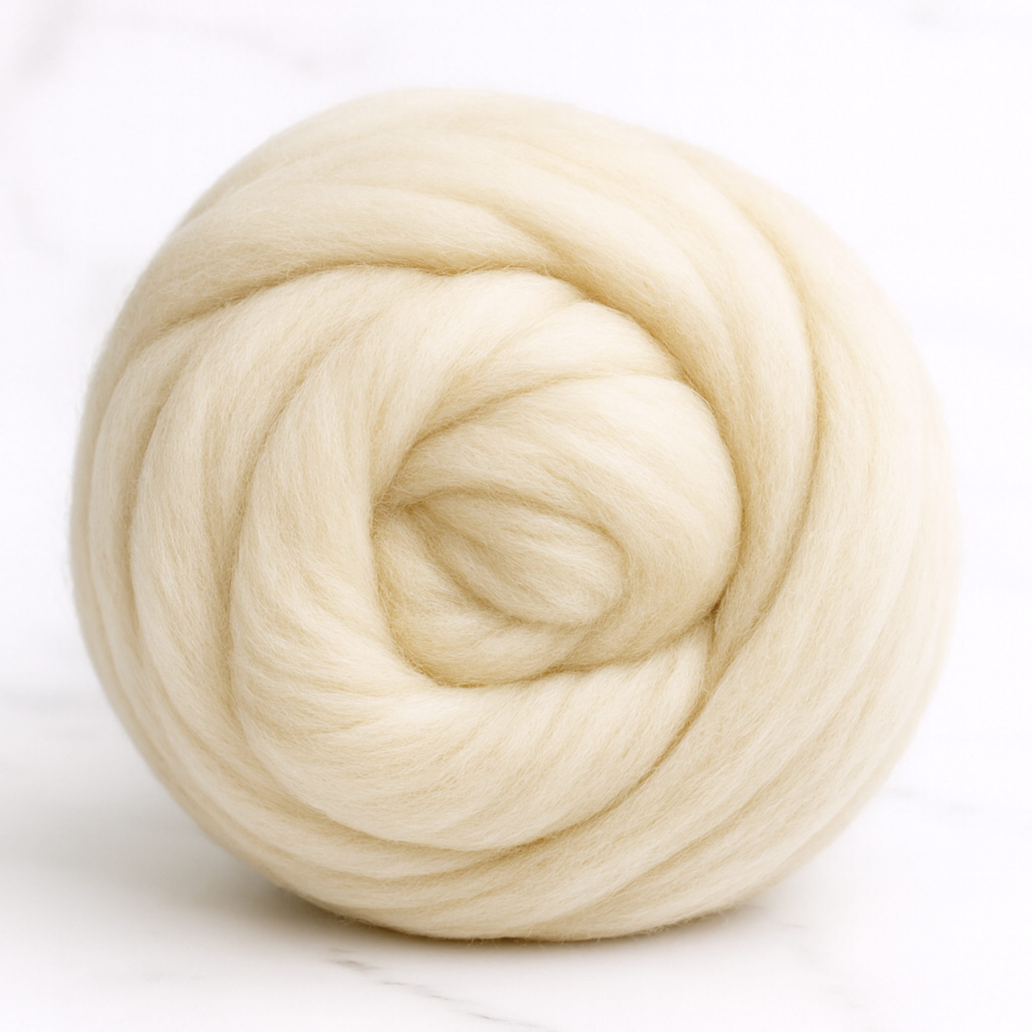 Revolution Fibers Corriedale wool roving top, natural undyed cream—1 lb combed top coiled neatly; soft spinning & felting fiber on white background.