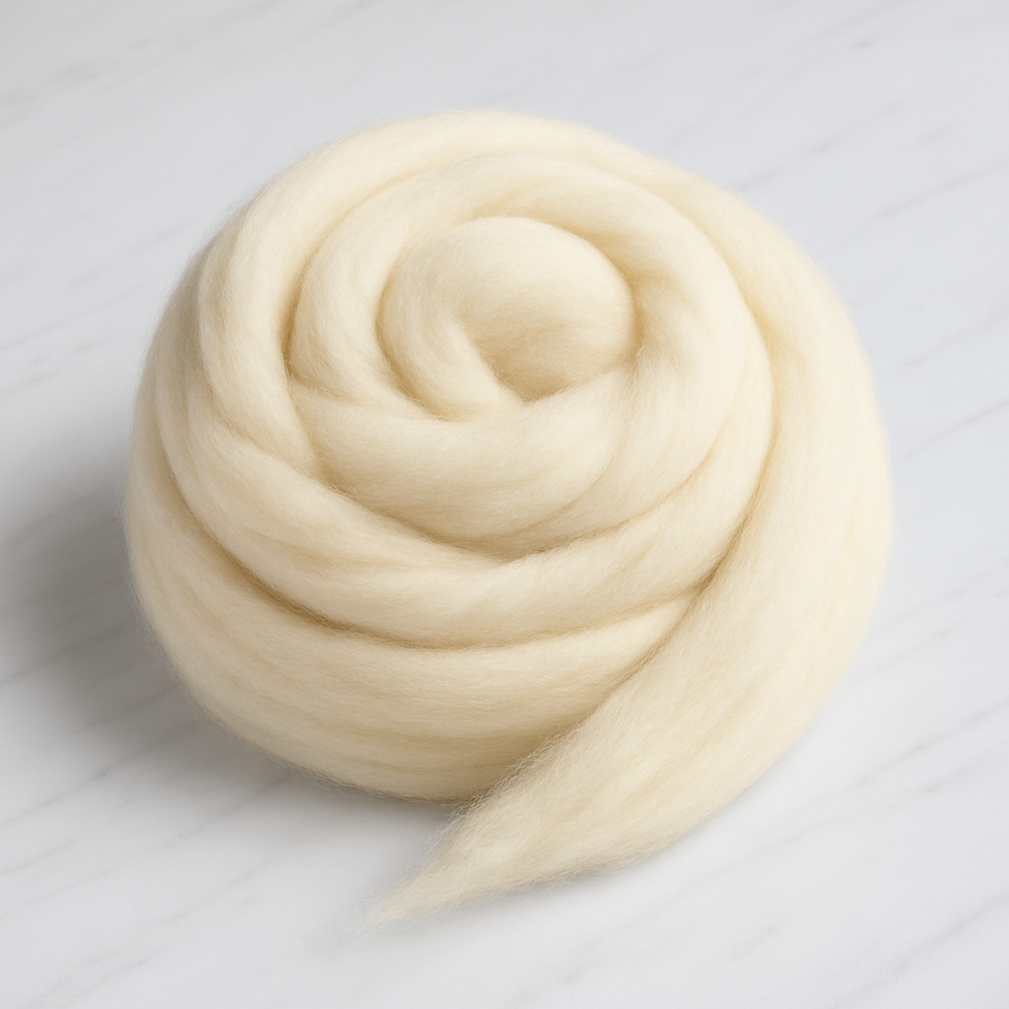 Corriedale wool top coil—undyed ivory, soft and durable combed roving for hand-spinning on drop spindle or wheel, felting, and weaving.