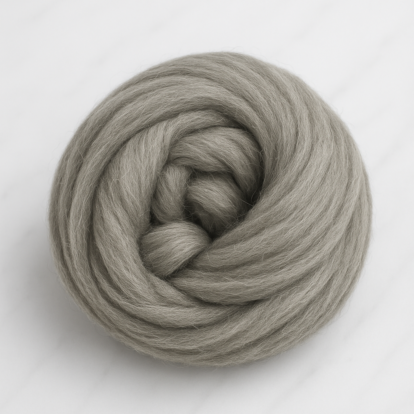 Coiled bundle of natural gray Corriedale combed top—1 lb undyed roving prepared for hand-spinning, blending, felting, and weaving.