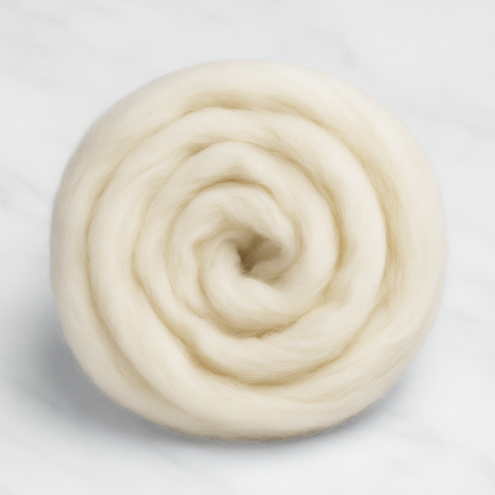 Loose coil of natural undyed Corriedale wool top—soft, versatile spinning fiber for blending, felting, and weaving projects.