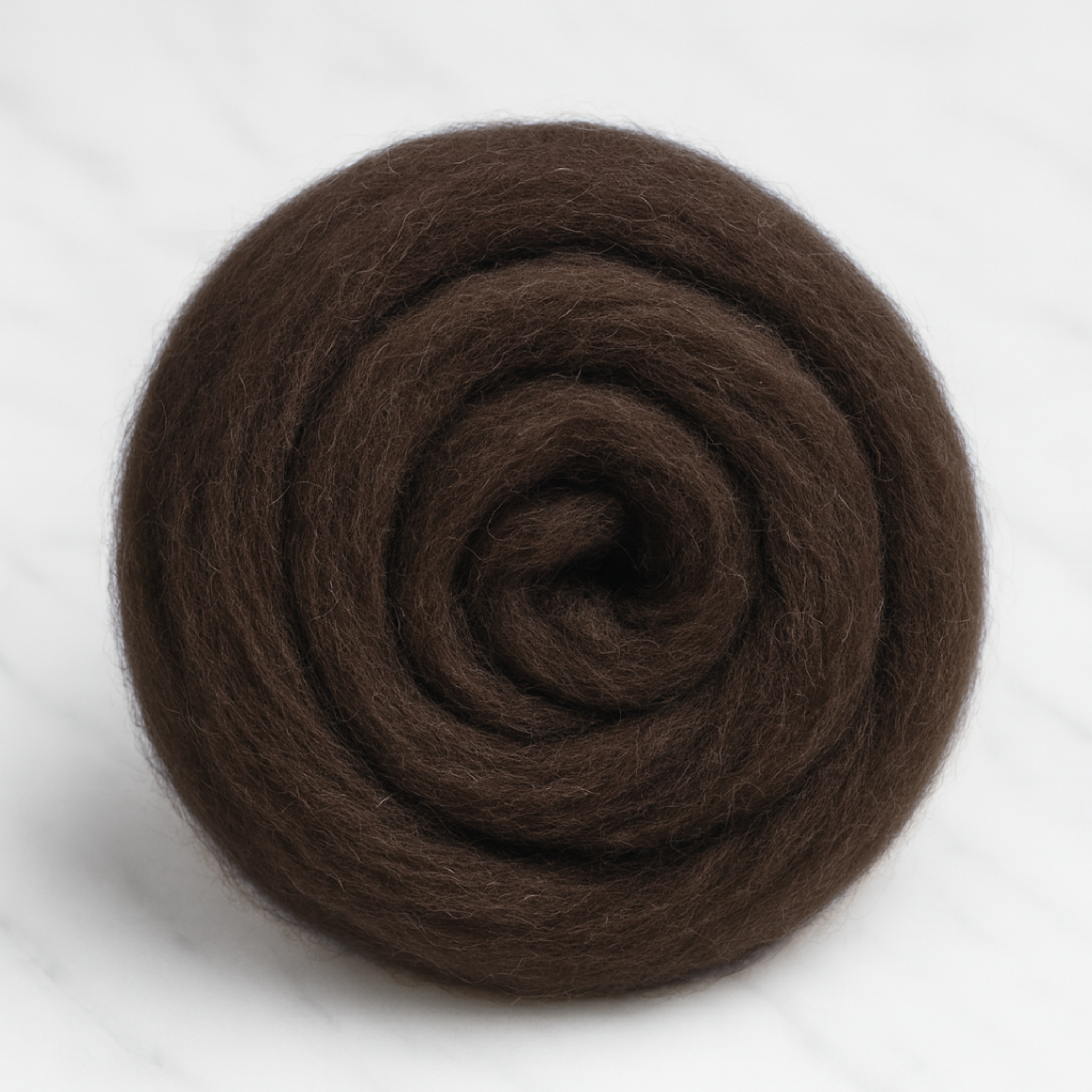 Loose coil of natural brown Corriedale roving—clean, versatile undyed wool for blending, weaving, needle felting, and wet felting.