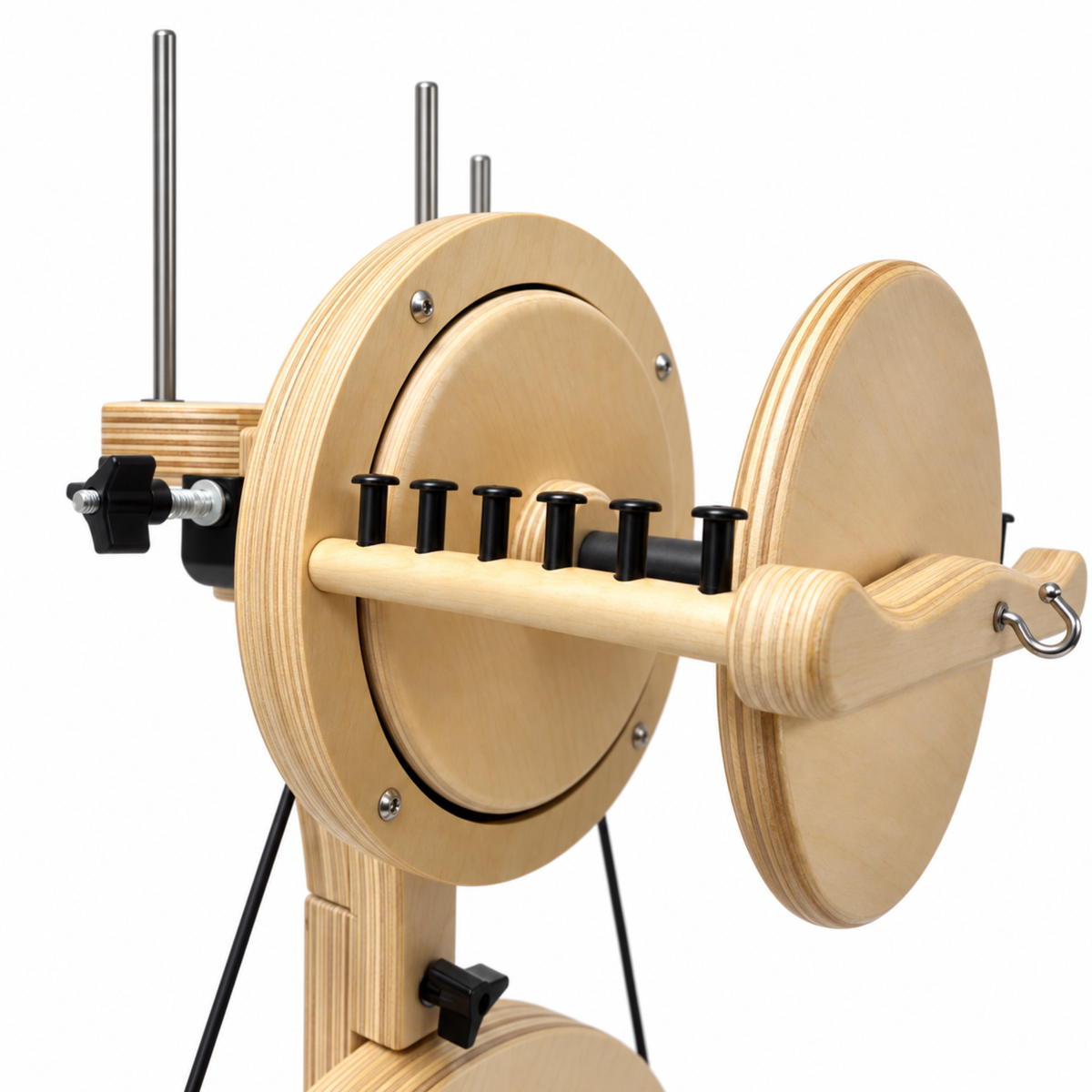 Side view of the SpinOlution Pollywog spinning wheel flyer and bobbin assembly with black yarn guides and wooden support frame.
