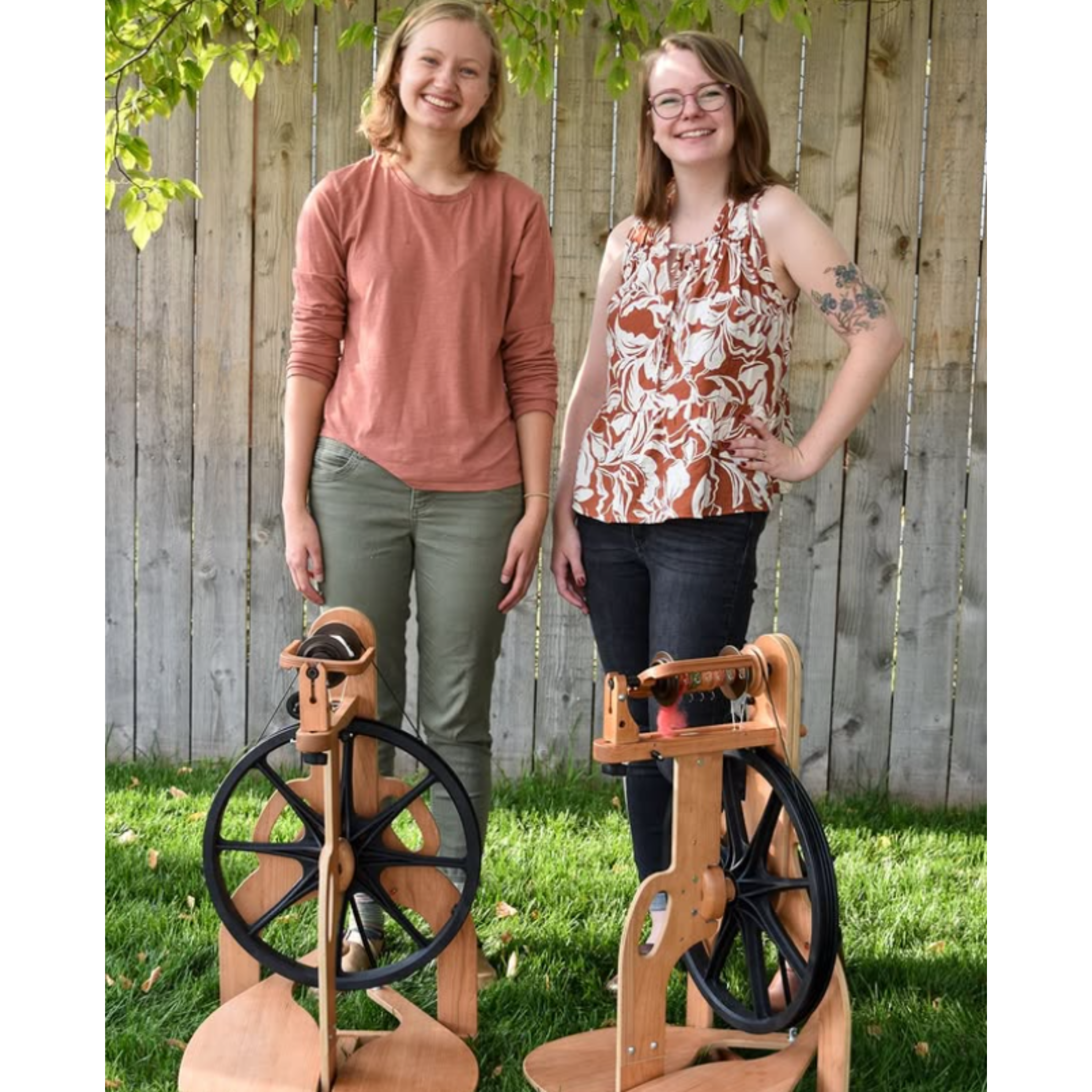 Outdoor lifestyle photo showing both models—2025 Limited Edition cherry (black wheel) and Classic maple (red wheel)—with two makers.