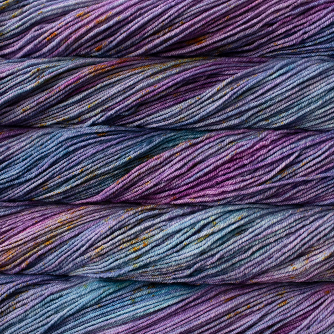 Malabrigo Rios hand-dyed worsted yarn in Pisces RIOS289, with variegated purple, blue, teal, and plum tones.