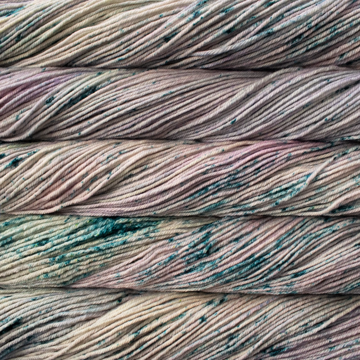 Malabrigo Rios hand-dyed worsted yarn in Virgo RIO283, with gray, taupe, pale sage, blue, and muted blush tones.