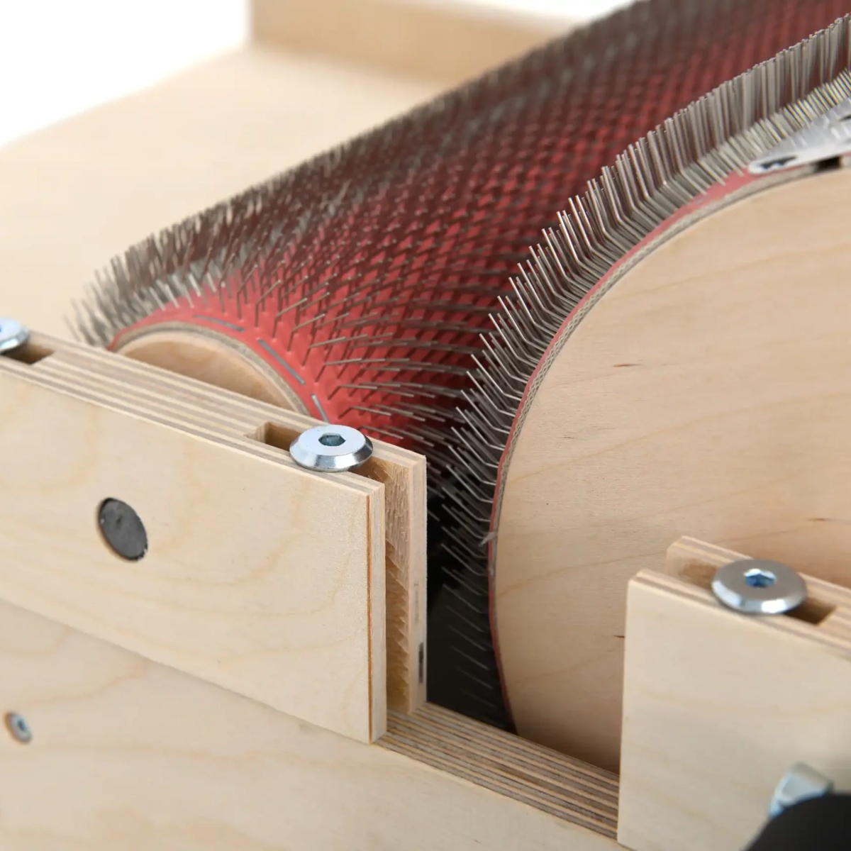 Close-up of the Golden Fleece WIDE 120 TPI drum carder showing the dense fine carding teeth on the main drum and licker-in.