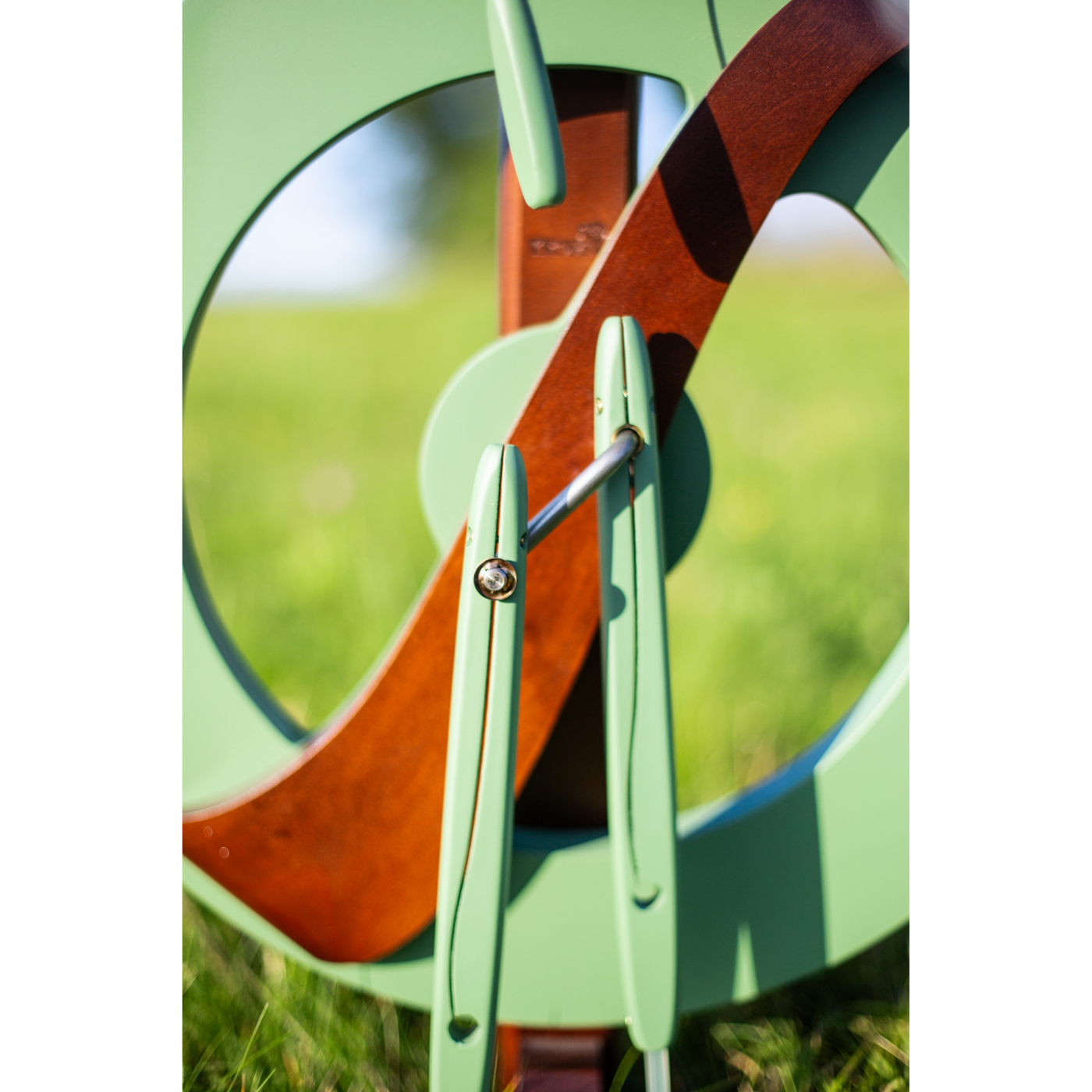 Limited edition Kromski Fantasia in meadow green with walnut accents. Macro shot of the treadle details.