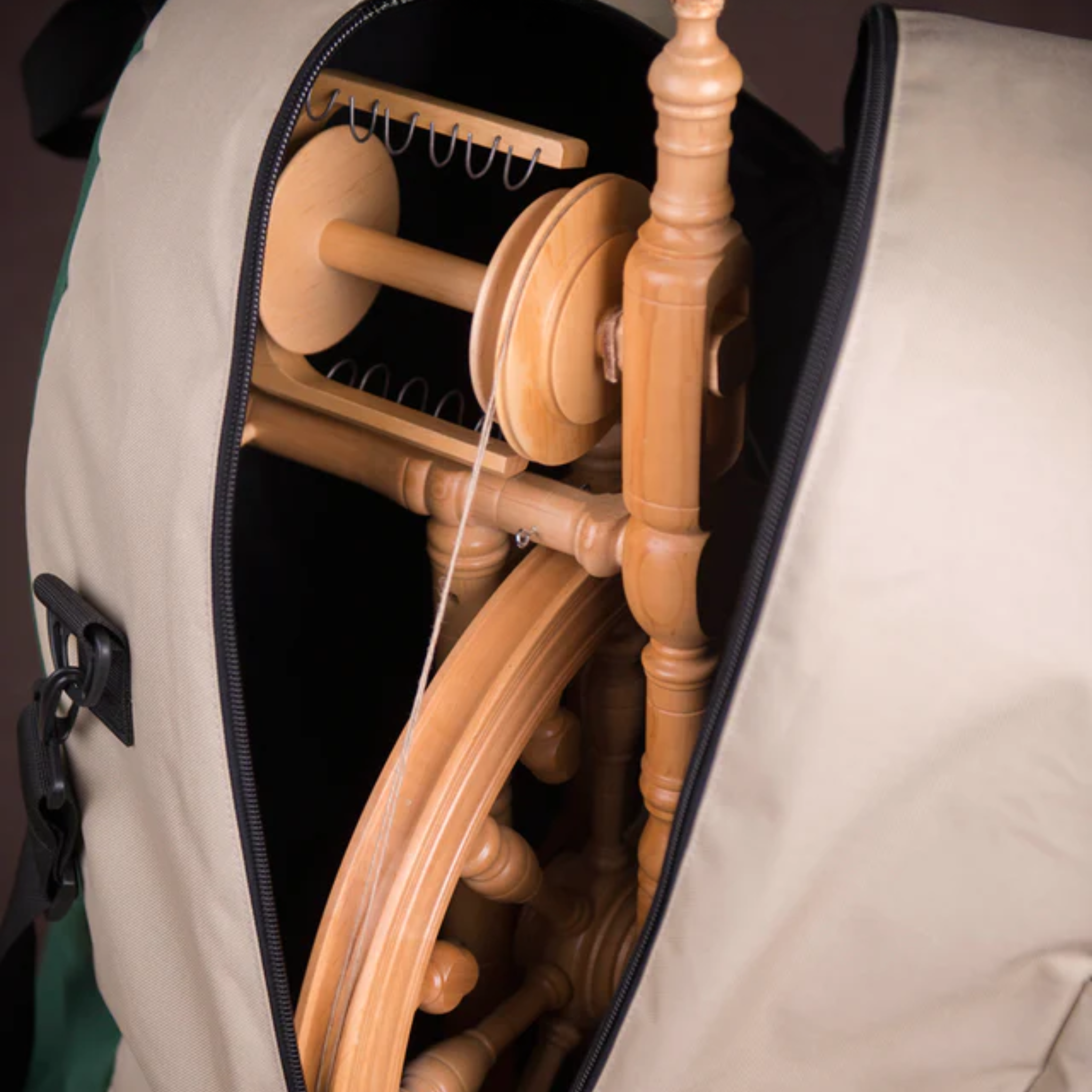 Kromski Minstrel spinning wheel packed inside padded wheel bag with zip opening—wheel protected and ready to travel.