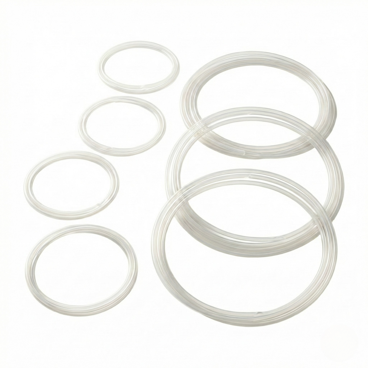 Top-down view of Kromski polyurethane drive band loops in graduated sizes for Kromski spinning wheels on a clean light background.