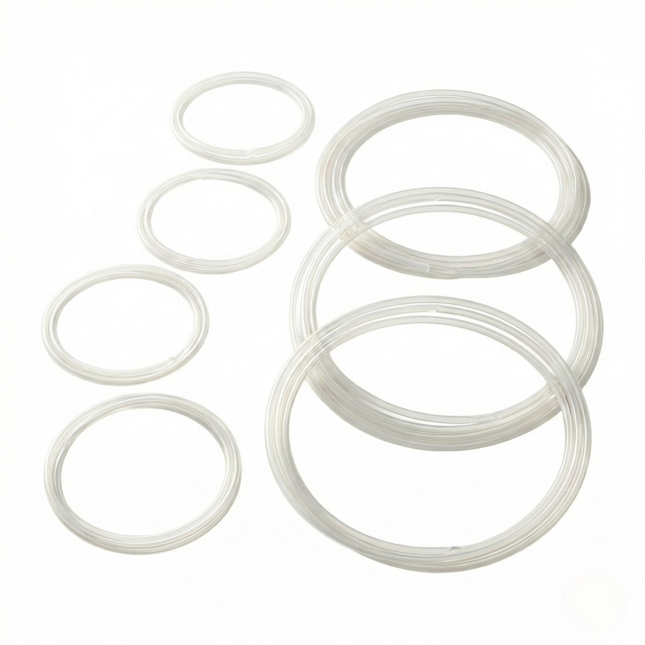 Top-down view of Kromski polyurethane drive band loops in graduated sizes for Kromski spinning wheels on a clean light background.