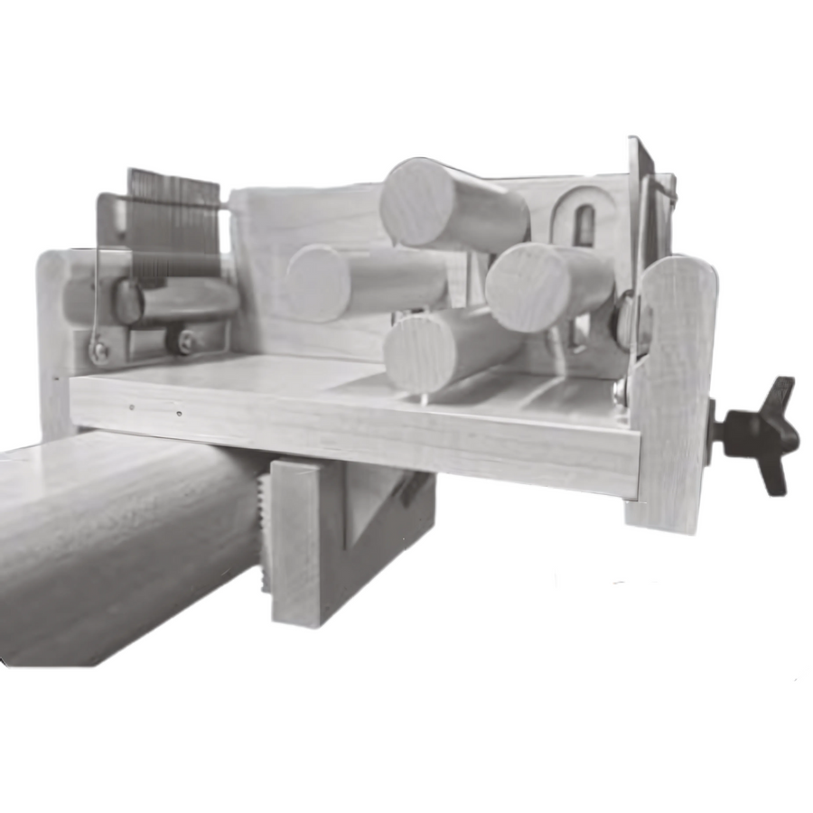 Monochrome view of Leclerc Tension Box attached to a loom, showing tensioning dowels, guide combs, and mounting hardware used for sectional warping setup.