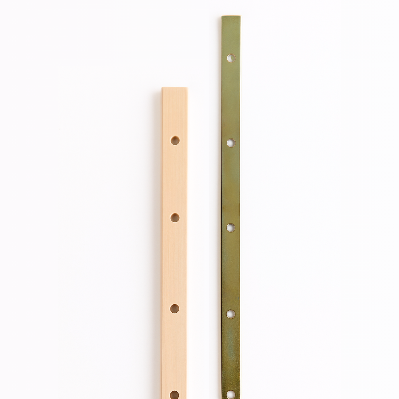 Side-by-side view of Leclerc wooden and metal loom beam sticks with pre-drilled holes, designed for securing warp threads on floor or table looms.