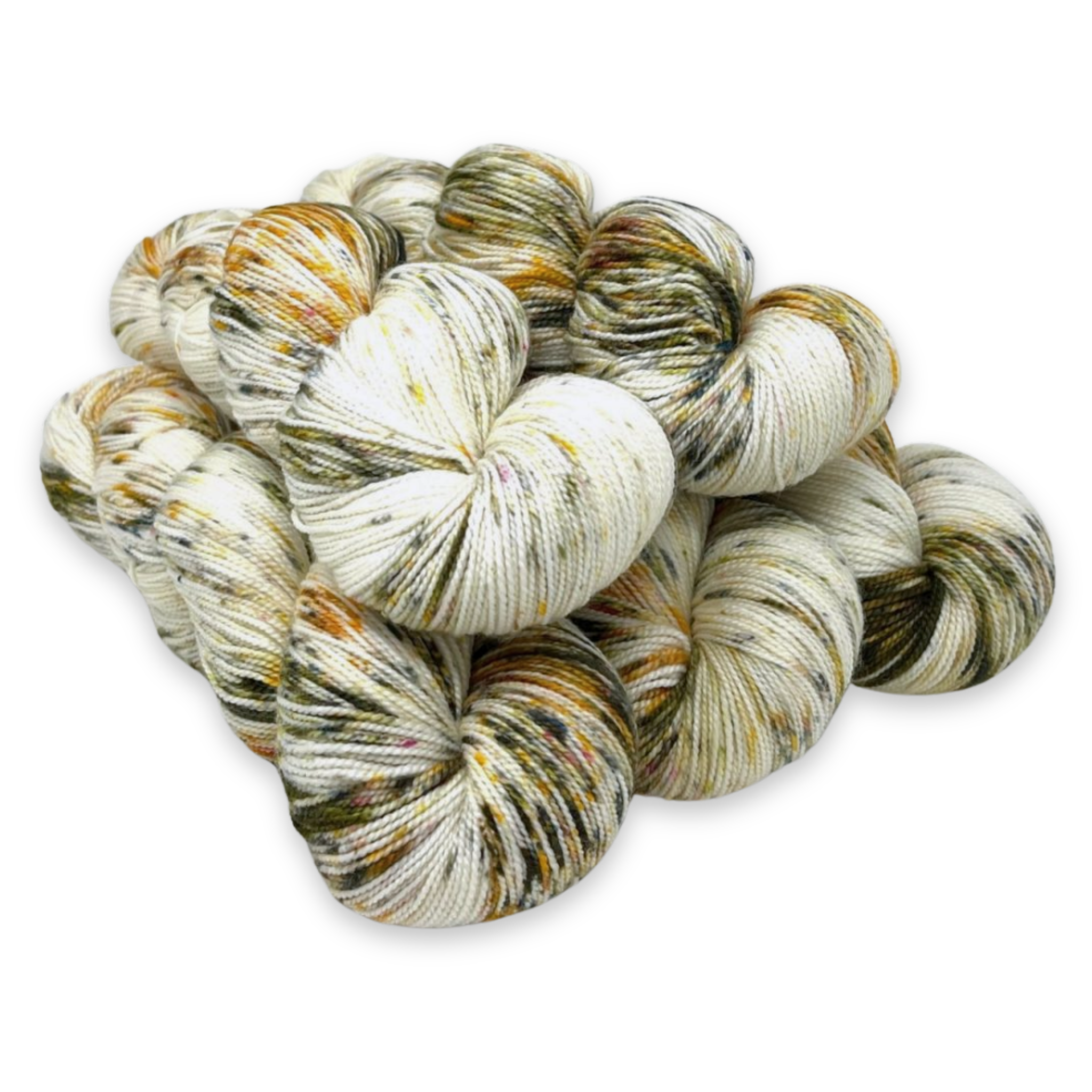 'Pistachio Ice Cream' – creamy white yarn with green and brown speckles in Baah La Jolla superwash merino by Revolution Fibers.