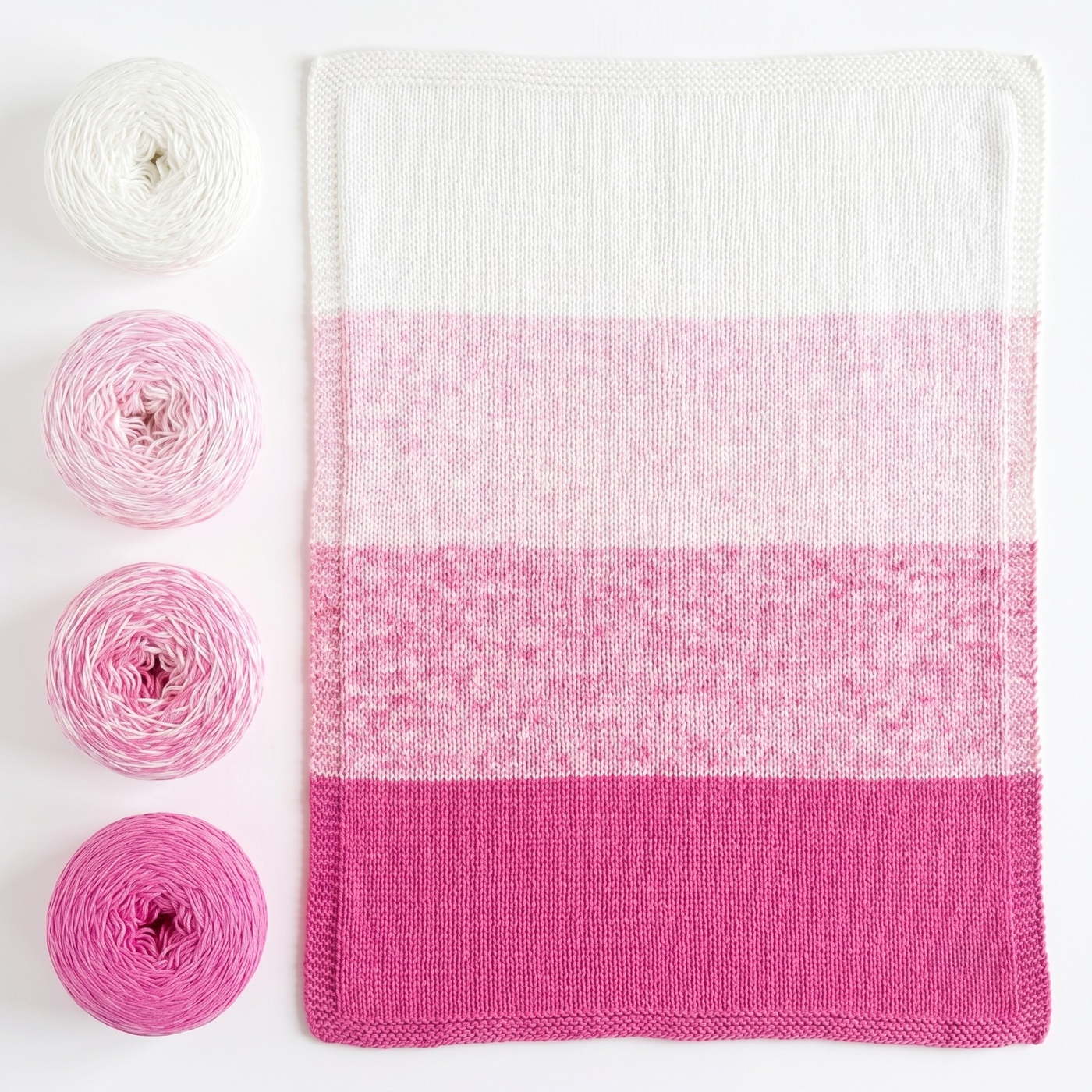 Revolution Fibers Baby Bloom Pink Flamingo baby blanket kit with matching yarn cakes and finished knit blanket.