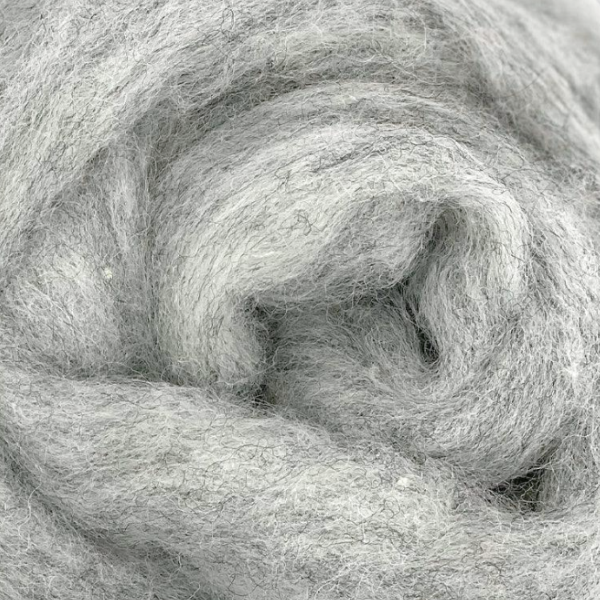 Drizzle colorway from Revolution Fibers Grey Spectrum Carded Corriedale Wool Sliver, light silvery gray wool fiber perfect for felting, spinning, and textile arts.