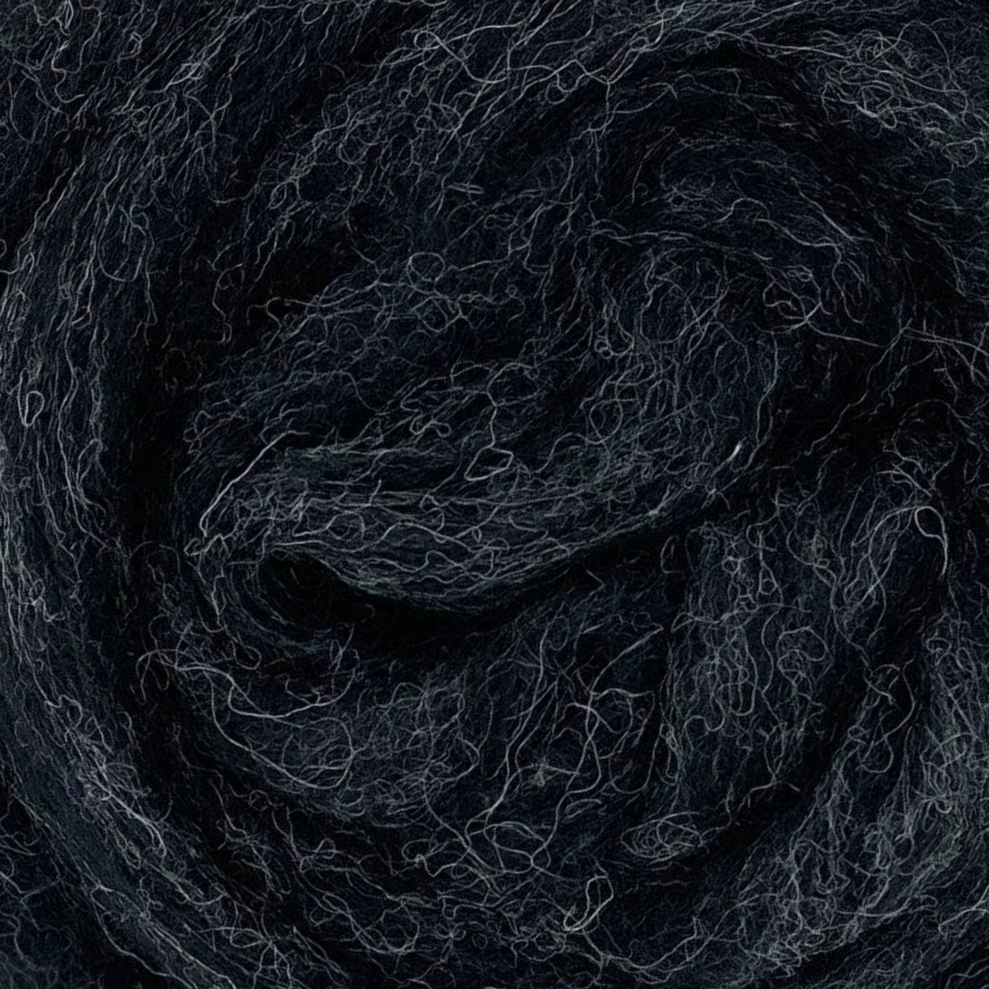 Thunder colorway from Revolution Fibers Grey Spectrum Corriedale Wool Sliver Variety Pack, dark charcoal gray carded wool fiber for felting, spinning, and fiber crafts.