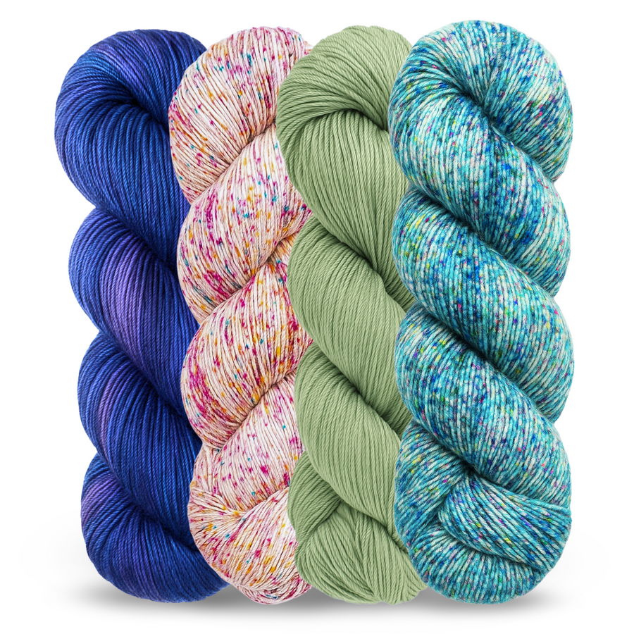 4 vibrant skeins of hand-dyed revolution fibers malabrigo superwash merino sock yarn in whales road, disfraz, jasmine, and parade. 