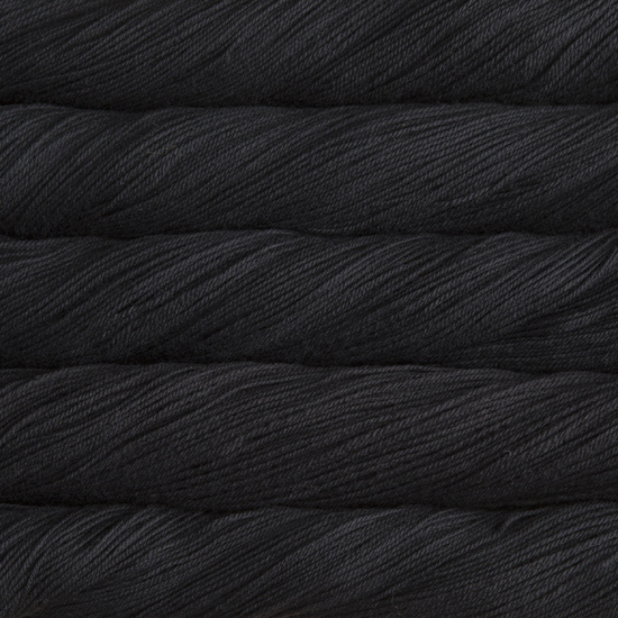 Malabrigo Sock Yarn Black SW195 – Solid black superwash Merino fingering yarn by Revolution Fibers.