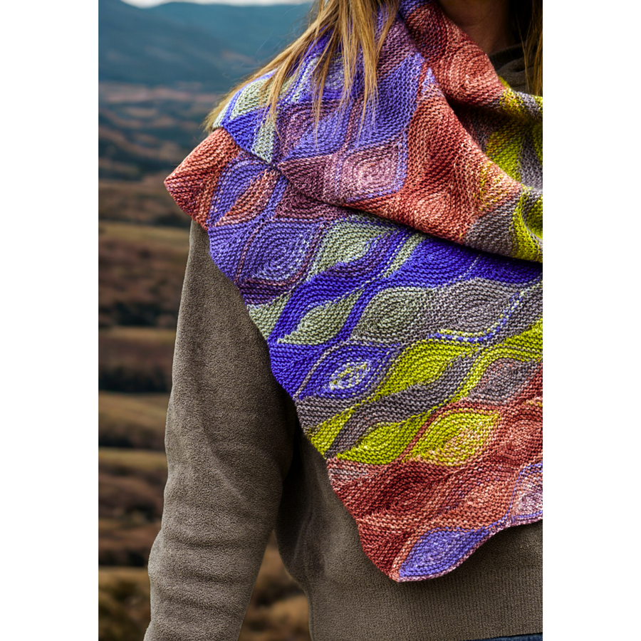Close drape of Hera Scarf in Uneek 3007 over a shoulder, emphasizing bold multicolor segments and textured short rows.