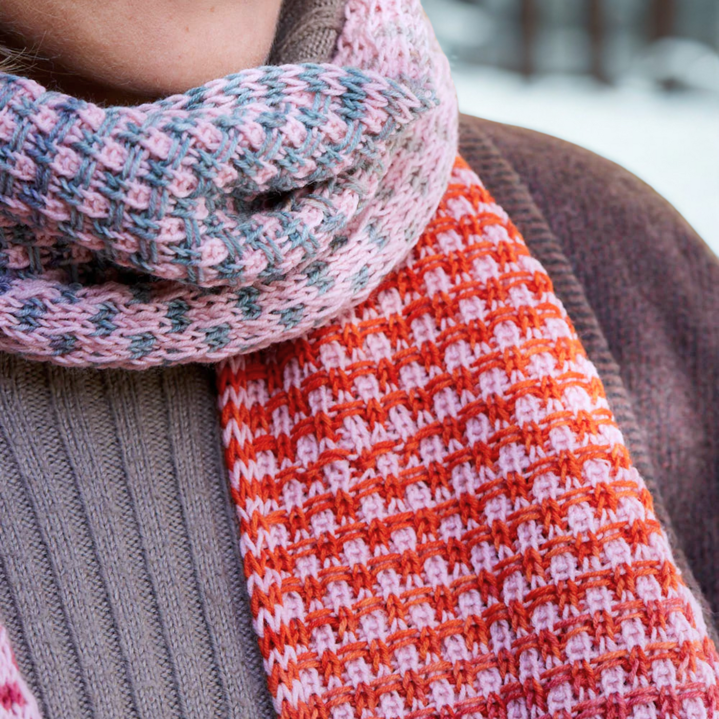 Close-up of Saman Scarf texture showing the slip-stitch bricks in Echoes 1519 and solid Core 1033 wrapped snugly around the neck.