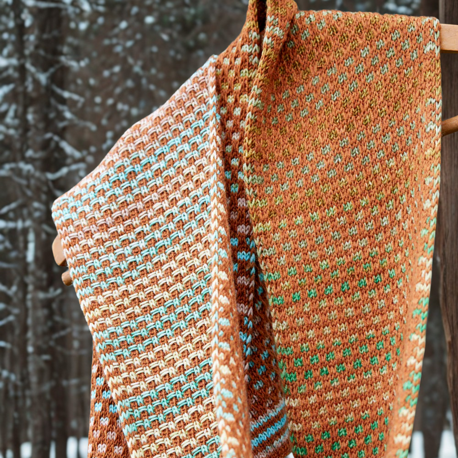 Close‑up of Saman Scarf knit with Uneek 3034 and Harvest Cinnamon, showing the basket‑weave side and dotted reverse.