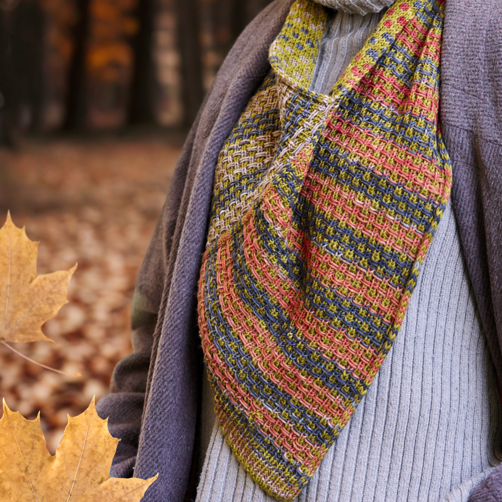 Detail shot of the Saman Cowl in Uneek 3021 and Harvest Fig elegantly draped over a coat.